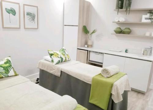 a hospital room with two beds and a sink at Blyde Lagoon in Pretoria