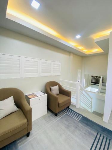 a living room with a couch and a chair at Grospe Resort Boracay in Boracay