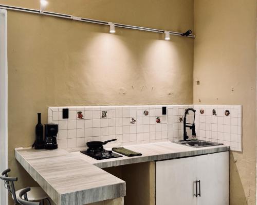 a kitchen with a sink and a counter top at Casa Zapata, Mérida Yucatán in Mérida