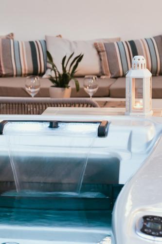 a living room with a couch and a swimming pool at Piccola Grande Casa in Mátraterenye