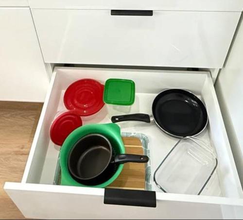 a drawer with pots and pans in a kitchen at Modern Studio Stylish &Cozy Ieft Unit in Los Angeles