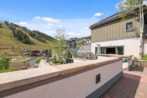 a view from the balcony of a house at Village Hall 13 by East West Hospitality in Beaver Creek