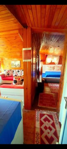 a small room with two beds in a room at Side Tuana Garden Home in Side