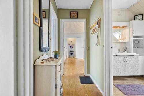 a kitchen with a sink and a counter in a room at 5598-Allinge-Ndr-Strandvej-4-A-1-th in Allinge