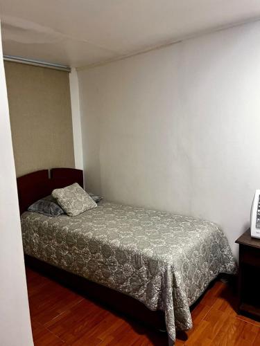 a bedroom with a bed in a room at Bocamar Aparthotel in Viña del Mar