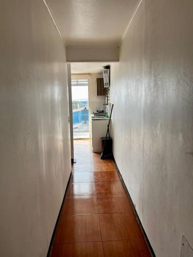 a hallway leading to a kitchen in a house at Bocamar Aparthotel in Viña del Mar