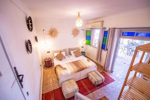 a bedroom with a bed in a room at KOUTOBIA ROYAL in Marrakech