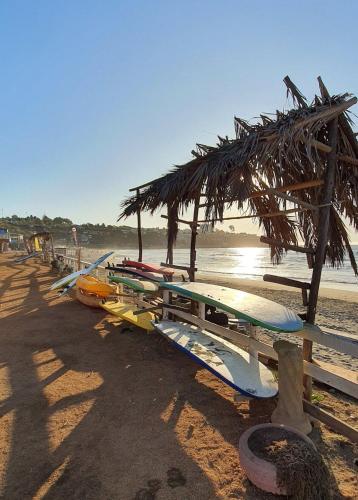 a bunch of surfboards are lined up on the beach at Bocamar Aparthotel in Viña del Mar