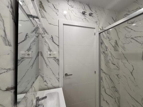 a bathroom with a shower and a toilet and a sink at Gabika Apartment 2 in Bilbao