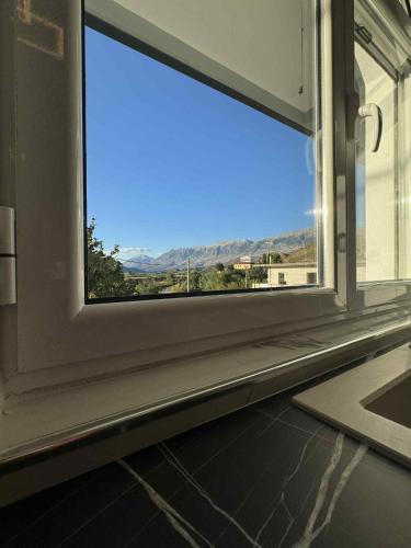 a window with a view of a mountain view at Old Castle Location in Gjirokastër