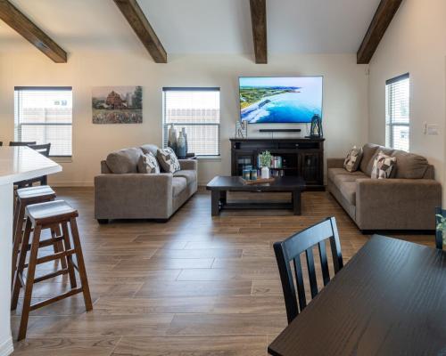a living room with a couch and a tv at Grecia's beautiful country home in Edinburg