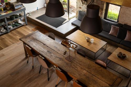 an overhead view of a living room with a table and chairs at B&B Maas en Heuvel Maastricht in Maastricht
