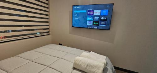 TV a/nebo společenská místnost v ubytování Apartamento moderno con estacionamiento
