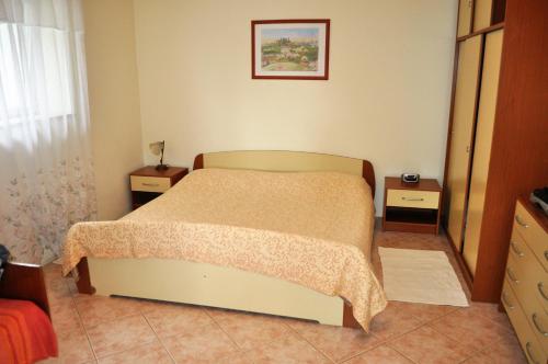 Postel nebo postele na pokoji v ubytování TRI SRCA apartments & rooms