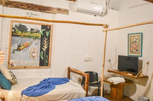 Hostel Pueblito Magico Mompósにあるベッド