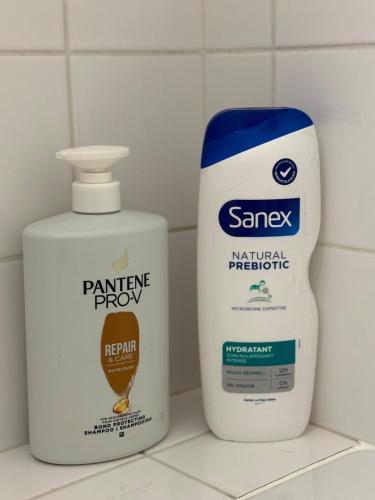 a bottle of sasy next to a container of paintner propolisificantificant at V&V La Vie Est Belle in Neuchâtel