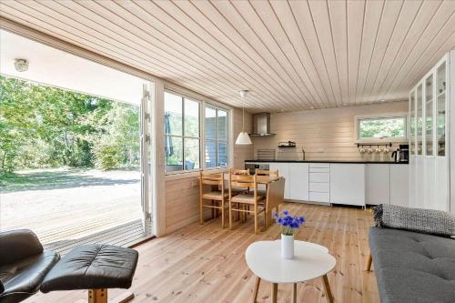 a living room with a couch and a table at 4754-Ronne-Stampen-Vej-8-Hus-5 in Rønne