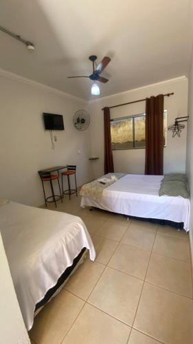 Katil atau katil-katil dalam bilik di Hotel Itiquira