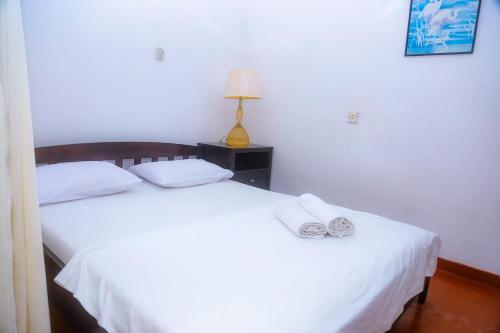 Una cama o camas en una habitación de Sakura Ocean View Mirissa