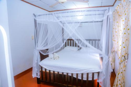 Una cama o camas en una habitación de Sakura Ocean View Mirissa