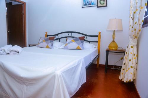 Una cama o camas en una habitación de Sakura Ocean View Mirissa