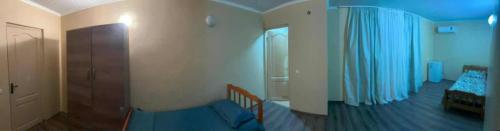 a bedroom with a bed and a blue ceiling at Mare in Ozurgetʼi