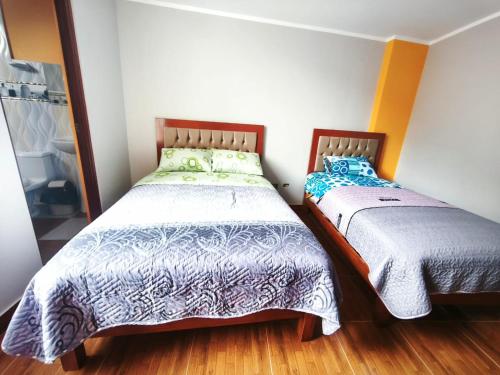 Postel nebo postele na pokoji v ubytování Los Andes - Hostal