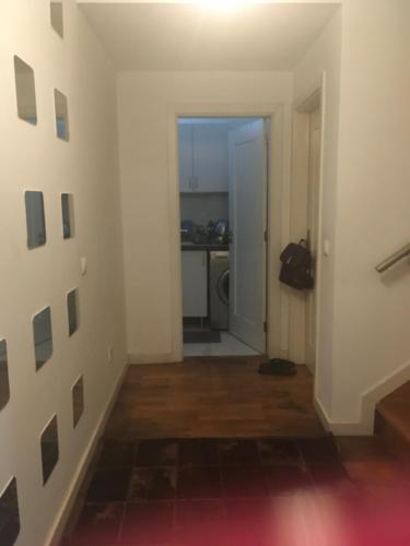 an empty room with a hallway with a kitchen at Triple room in a House with a pool in Quejas