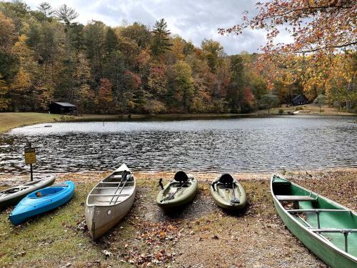 a group of four boats on the shore of a lake at Willow Falls in Blue Ridge