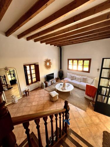 a living room with a couch and a table at Luxurious finca with pool, Soller - Mallorca in Sóller