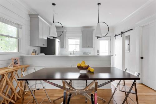 a kitchen with a table with a bowl of fruit on it at Best in Show in Atlanta