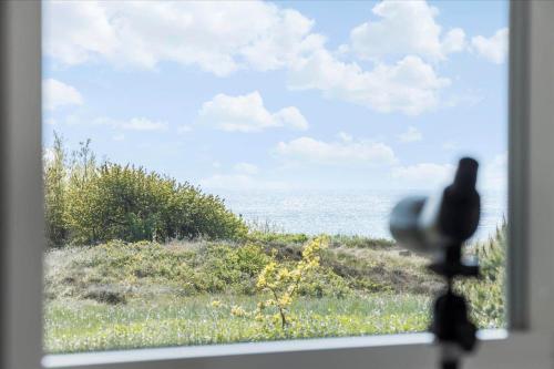 a view of the ocean from a window with a camera at 1464-Aakirkeby-Holsteroddevej-5 in Vester Sømarken