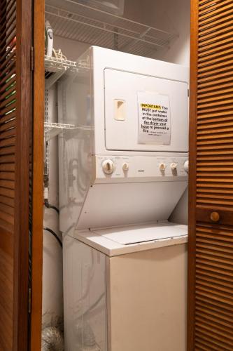 a refrigerator with its door open in a kitchen at Multi-unit beachside complex for up to 12 guests in San Juan