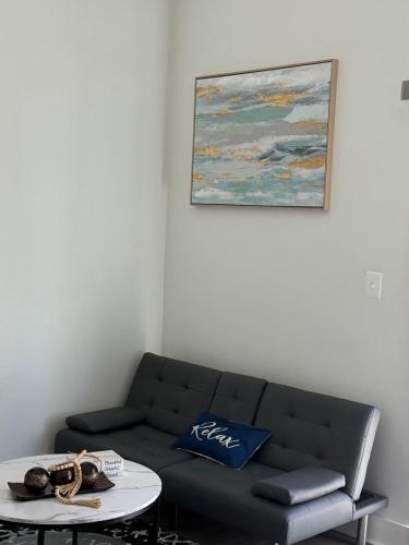 a living room with a couch and a table at Modern 1-Bedroom Apartment in Downtown Baltimore in Baltimore