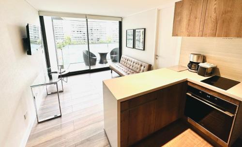 a kitchen with a counter top in a room at Arauco Premium Suite in Santiago