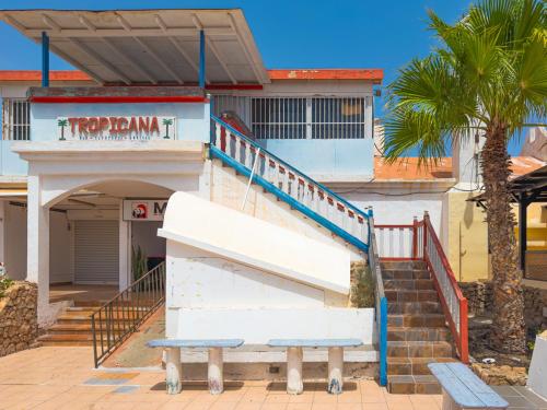a building with a staircase in front of a building at Blue Río Playa, Casa & Studio in Costa Calma