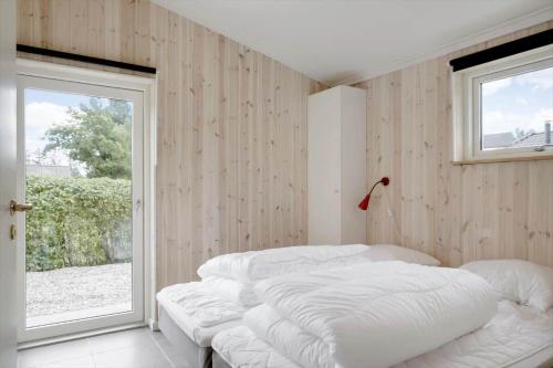 a bedroom with two white beds and a window at OH467-Storvorde-Birke-Alle-15 in Storvorde