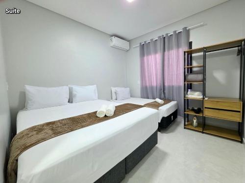 Postel nebo postele na pokoji v ubytování Casa novíssima 10 min das Cataratas 2 quartos