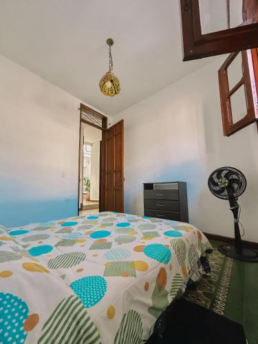 a bedroom with a large bed in a room at Laundry House in Cali