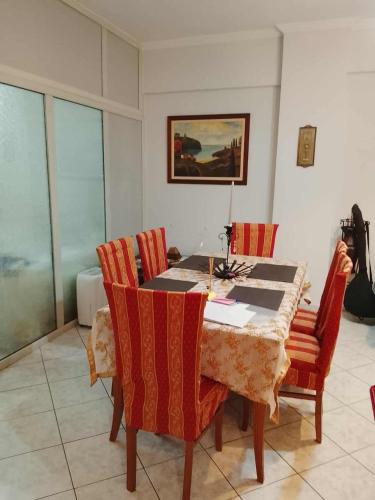 a dining room with a table and chairs at Savelona's Guest Appartment in Agrinion