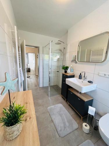a bathroom with a sink and a mirror at Fewo am Tüllinghof in Lüdinghausen