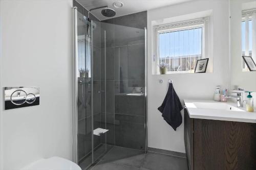 a bathroom with a shower and a sink at 4797-Allinge-Havnevej-14-C-1-th in Allinge