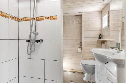 a bathroom with a shower and a toilet and a sink at 6832-Hasle-Toftegardsvej-20-C in Hasle