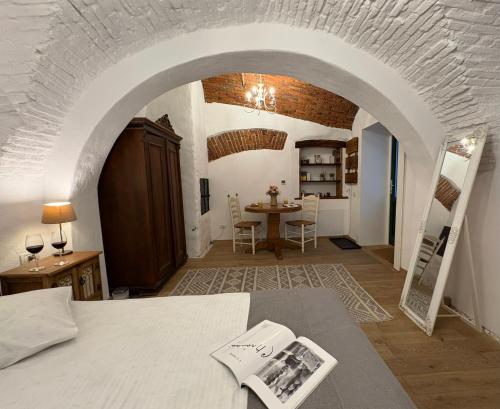 a living room with a table and an archway at Old Town Sibiu Apartment - Historical Center Residence in Sibiu
