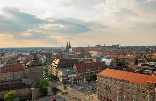an aerial view of a city with buildings at Leonardo Royal Hotel Nürnberg in Nuremberg