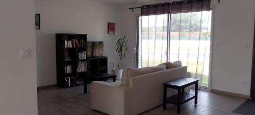 Posezení v ubytování Chambre avec salle de bain et WC privés