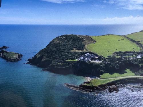 an aerial view of an island in the ocean at Cois Cuan in Ballynagaul