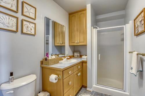 a bathroom with a toilet and a sink and a shower at Lakefront Oasis at Lake Stevens in Lake Stevens
