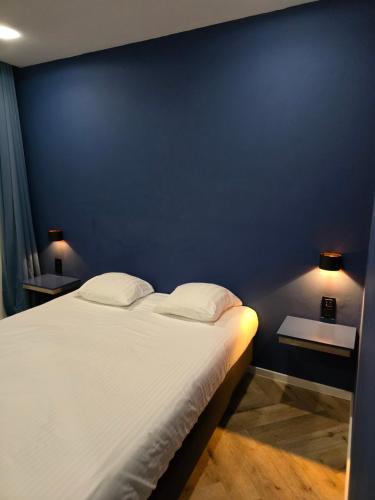 Postel nebo postele na pokoji v ubytování Hotel Port