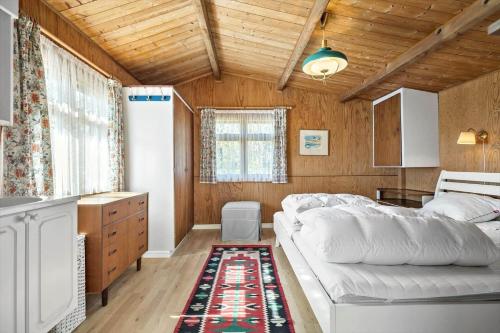 a living room with a white couch in a room at 6685-Allinge-Tejnvej-24 in Allinge
